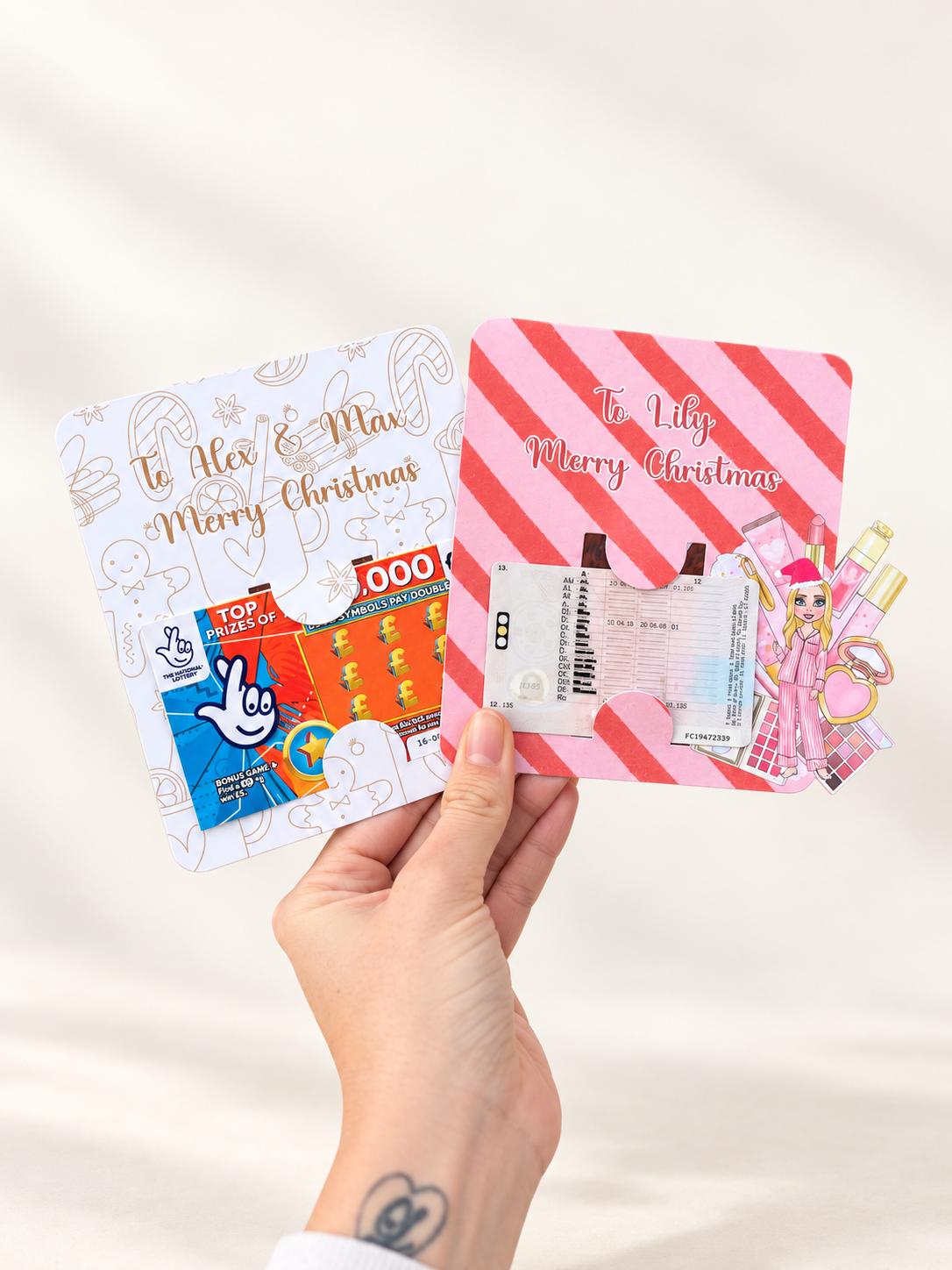 Two personalised Christmas gift card holders with custom names and festive designs