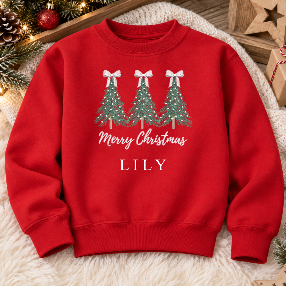 Red personalised Christmas sweatshirt with three embroidered bow-topped Christmas trees