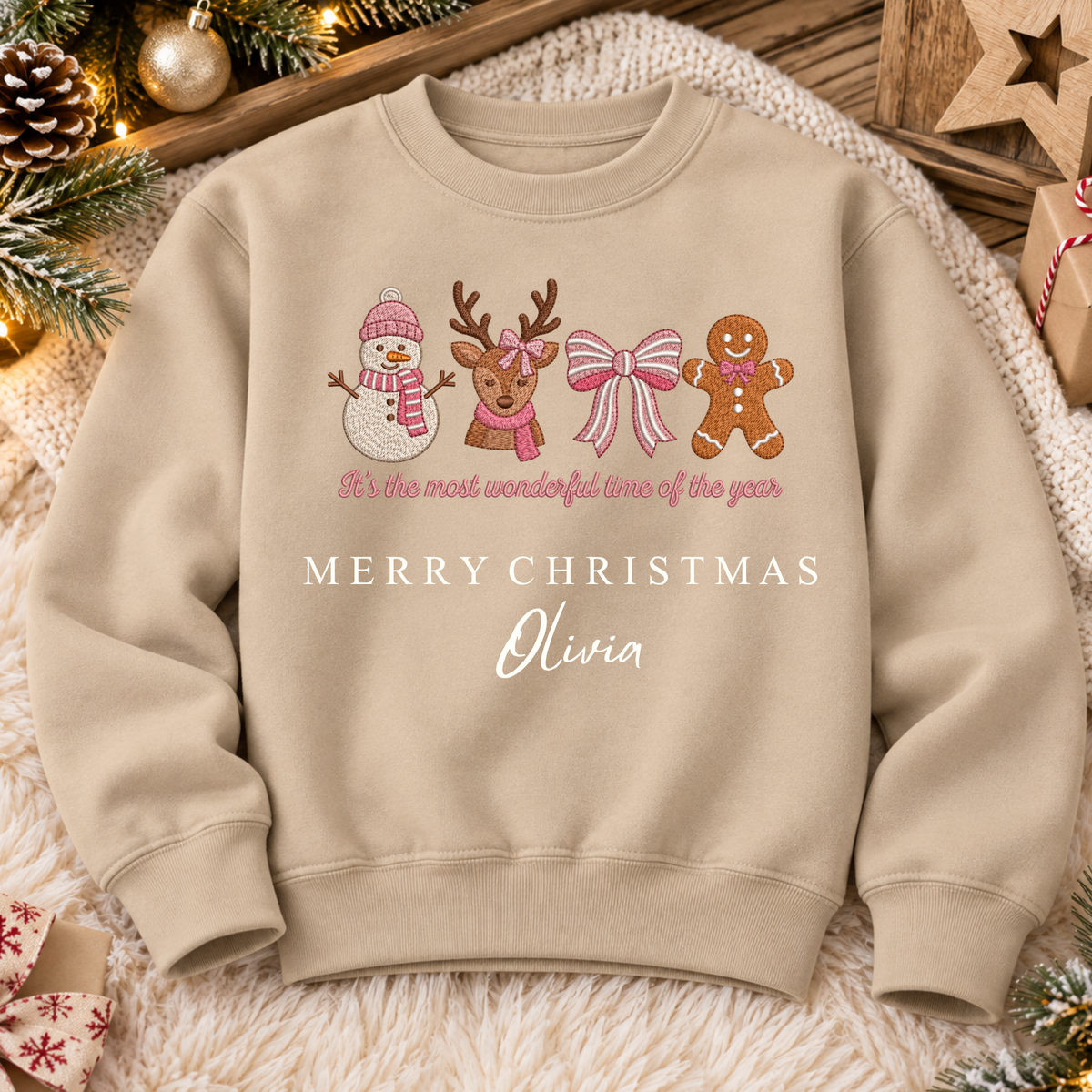 Nude personalised Christmas sweatshirt with embroidered snowman, reindeer, bow and gingerbread design