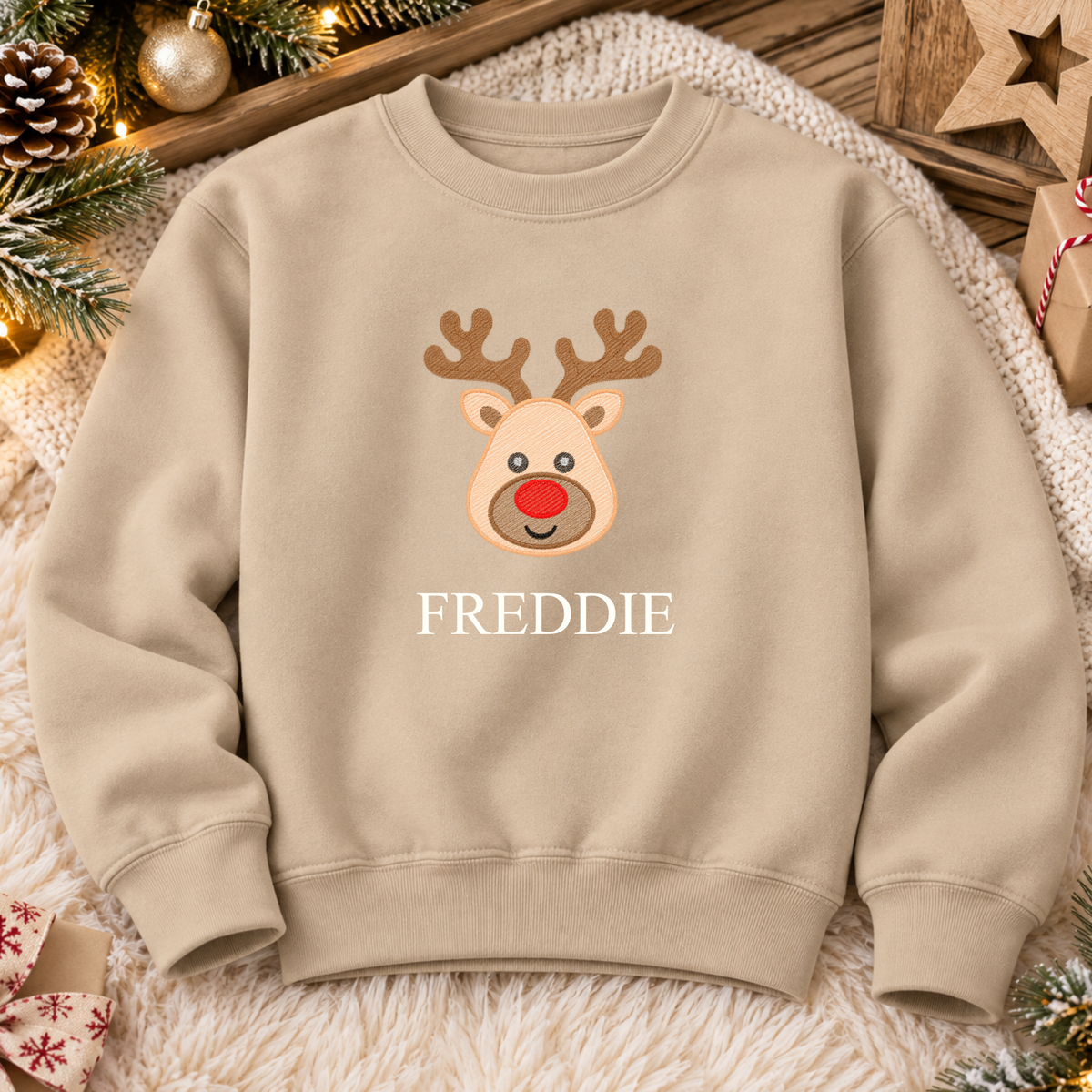Nude personalised Christmas sweatshirt with an embroidered red-nosed reindeer