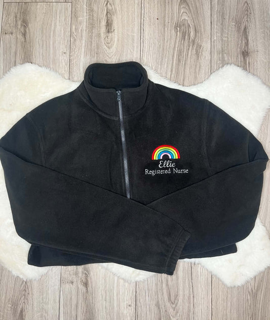 Black fleece with multicoloured rainbow embroidery, Ellie name and Registered Nurse wording