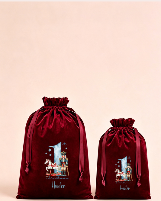 Personalised red velvet Christmas sack in medium and large with blue nutcracker Christmas design