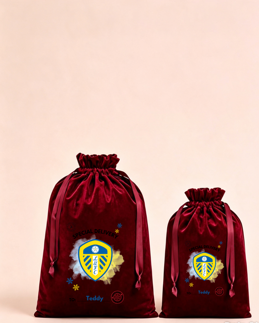 Personalised red velvet Christmas sack in medium and large with football fan crest design