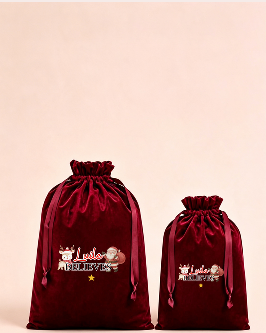Personalised red velvet Christmas sack in medium and large with My Little Believer design