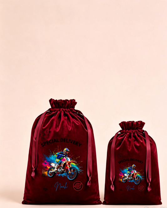 Personalised red velvet Christmas sack in medium and large with special delivery motocross design