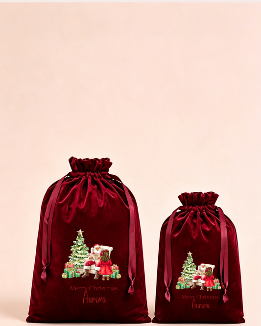 Personalised red velvet Christmas sack in medium and large with reindeer and presents